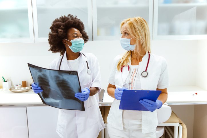 Healthcare worker in a conversation with an allied health specialist
